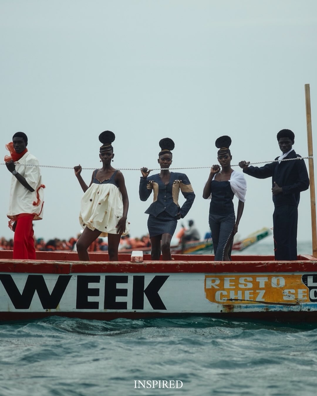 Dakar Fashion Week models afloat on the Atlantic Ocean